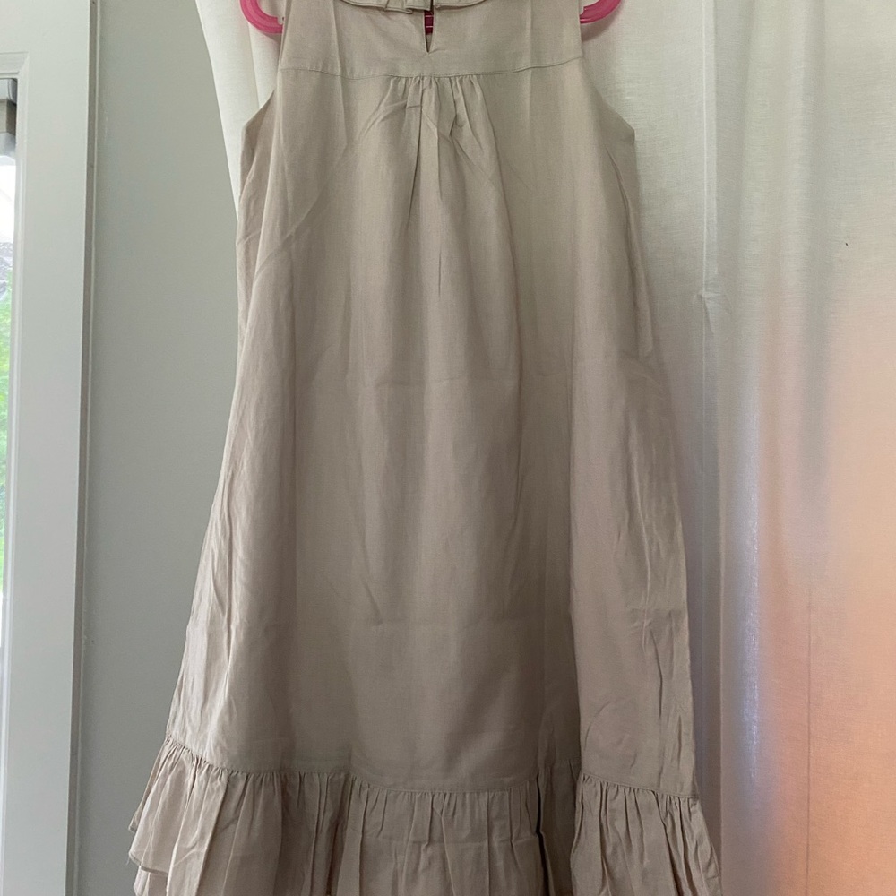 Ruffle bottom dresses, one button closer at back